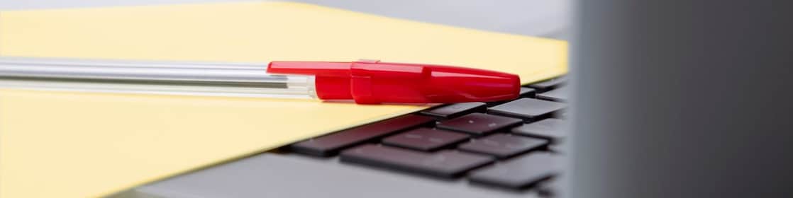 photo-of-red-pan-on-yellow-piece-of-paper